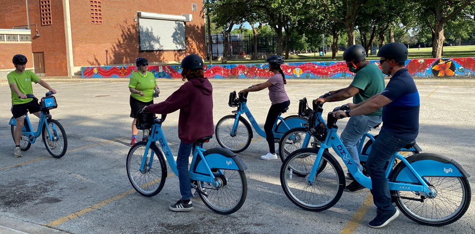 A group of people on Divvy bikes at a Learn to Ride Class